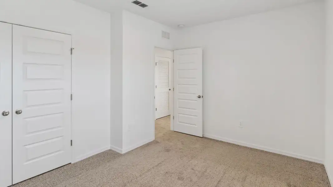 Representative unfurnished interior of a home built from the Coral by D.R. Horton in Hawthorne Ranch, Lakeland (Image 44).