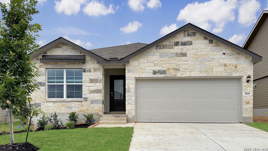 Front exterior of a new home in Redbird Ranch, San Antonio, TX, highlighting curb appeal (Image 1). Front exterior of a new home in Redbird Ranch, San Antonio, TX, highlighting curb appeal (Image 1).