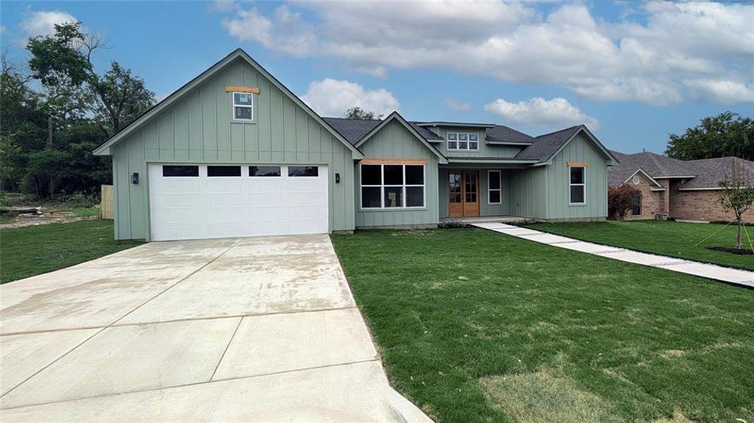 Front exterior of a new home in , Weatherford, TX, highlighting curb appeal (Image 23).