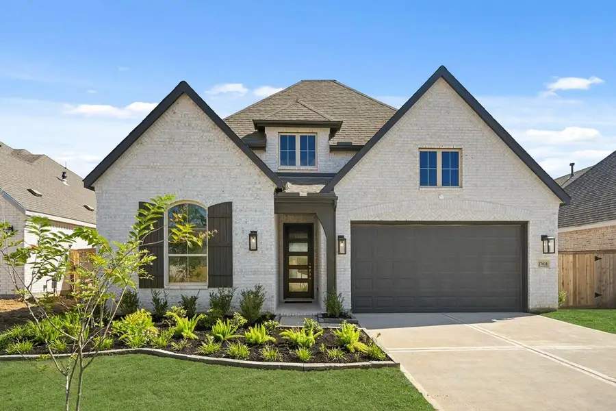 Front exterior of a new home in Kresston: 55ft. lots, Magnolia, TX, highlighting curb appeal (Image 1).