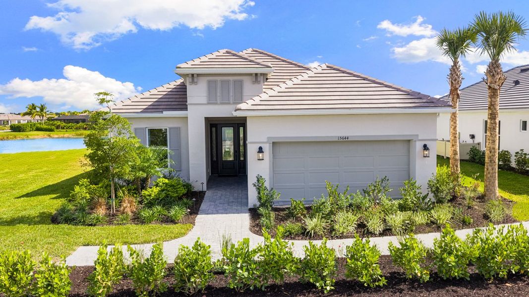 Representative exterior photo of a completed home built from the Marino by Taylor Morrison in Esplanade at Kingston, Estero, FL (Image 1). Representative exterior photo of a completed home built from the Marino by Taylor Morrison in Esplanade at Kingston, Estero, FL (Image 1).