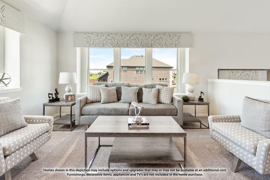 Bright living room with gray sofa, accent chairs, coffee table, and large windows overlooking neighborhood homes. Bright living room with gray sofa, accent chairs, coffee table, and large windows overlooking neighborhood homes.