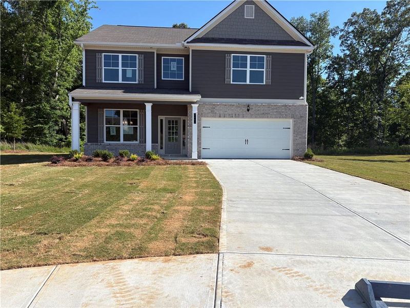 Front exterior of a new home in Highland Park, Stonecrest, GA, highlighting curb appeal (Image 2). Front exterior of a new home in Highland Park, Stonecrest, GA, highlighting curb appeal (Image 2).