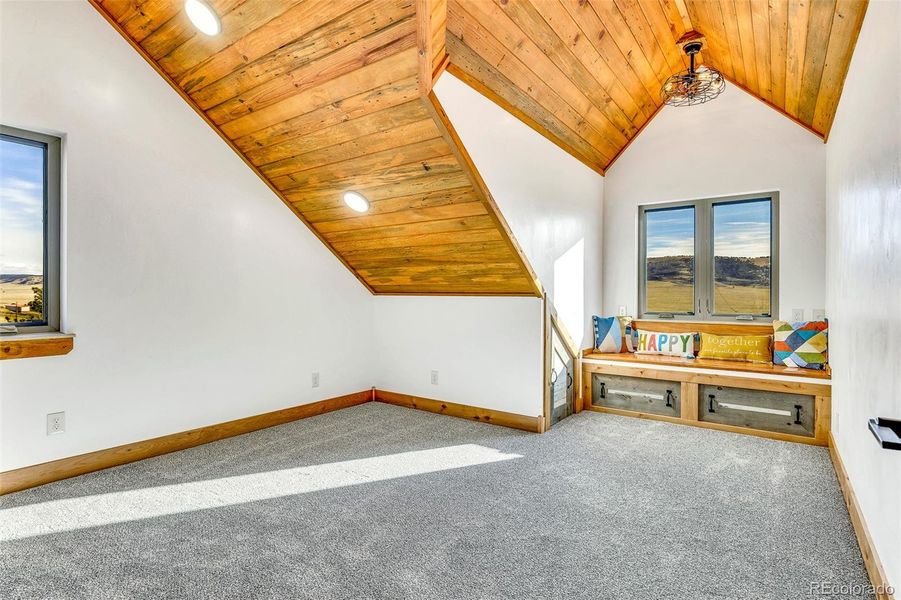 Gorgeous T&G ceiling highlights accentuates the character of this room. The built in window seat provides storage below!