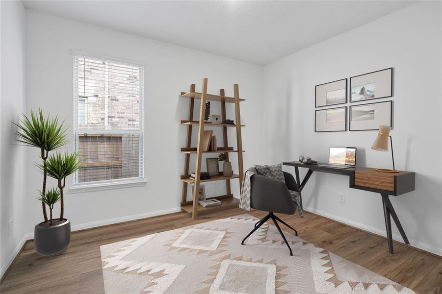 Quietly nestled in front of the home is the handsome home office or den. Featuring gorgeous flooring, custom paint, large window with privacy blinds, and lighting.