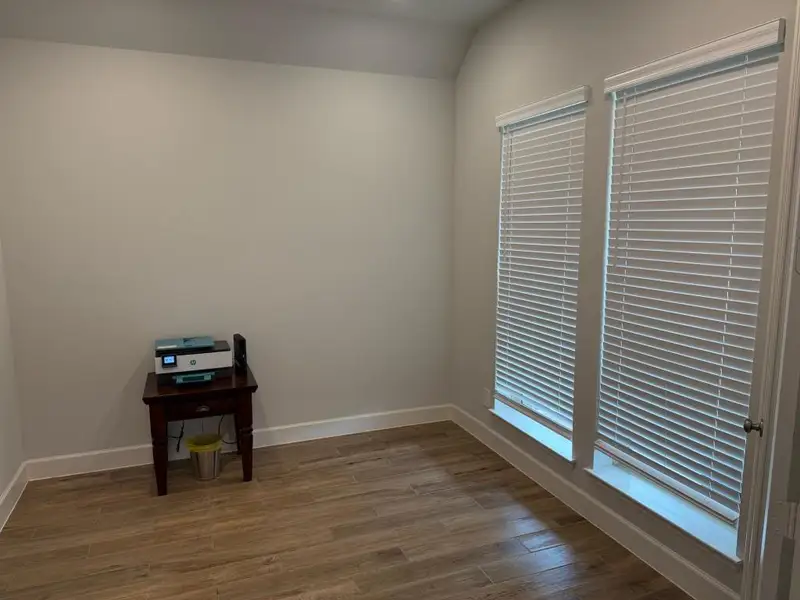 Furnished interior view inside a new home in Grand Central Park 45', Conroe (Image 6).