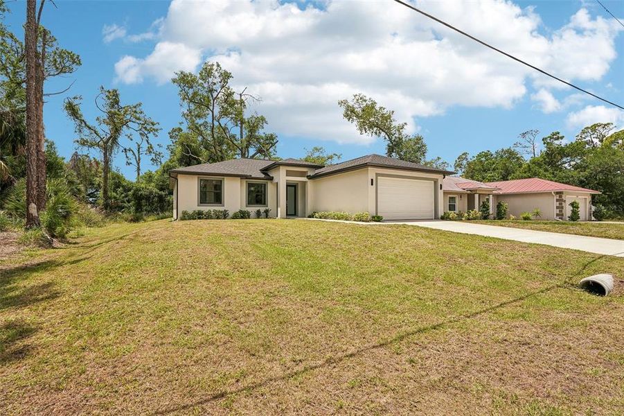 Front exterior of a new home in , Port Charlotte, FL, highlighting curb appeal (Image 22).
