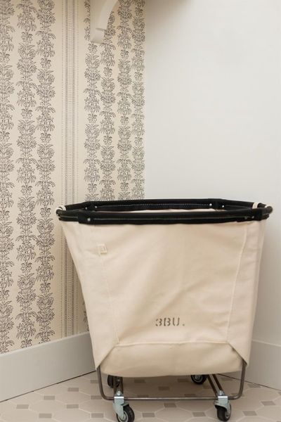 Designer wallpaper sets off the laundry room, White baseboard trim, spacious room Designer wallpaper sets off the laundry room, White baseboard trim, spacious room