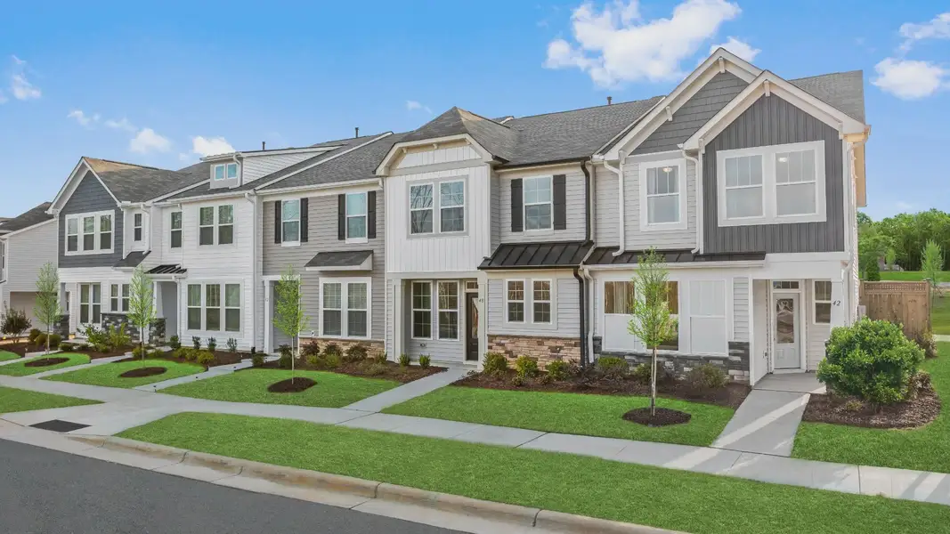 Front exterior of a new home in Battle Bridge, Raleigh, NC, highlighting curb appeal (Image 1). Front exterior of a new home in Battle Bridge, Raleigh, NC, highlighting curb appeal (Image 1).