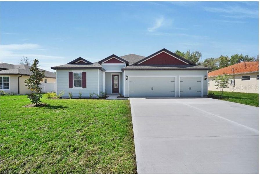 Front exterior of a new home in , Ocala, FL, highlighting curb appeal (Image 2).
