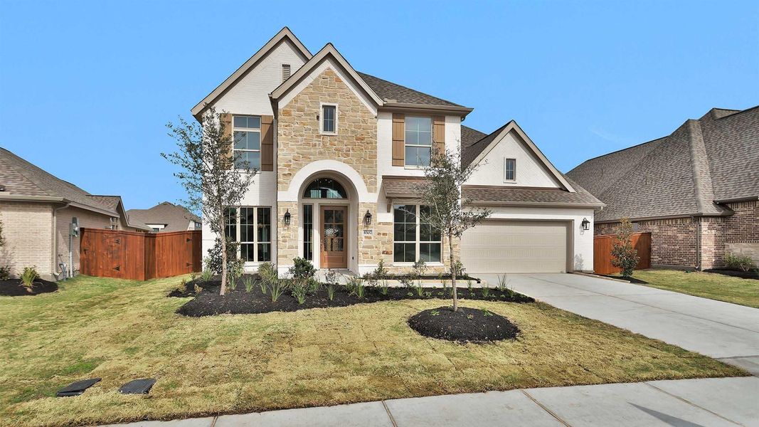 Front exterior of a new home in Meridiana, Manvel, TX, highlighting curb appeal (Image 2).