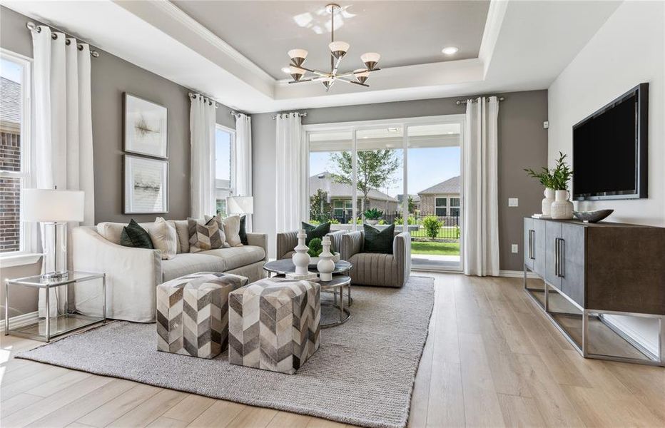 *Model Representation - Spacious gathering room with large windows