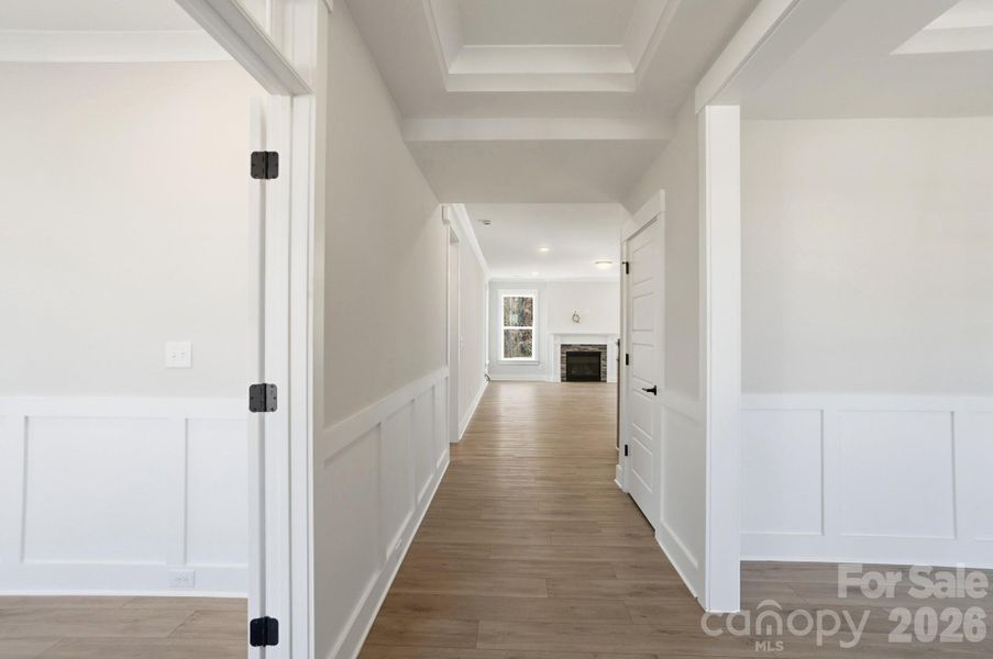 Foyer flanked by office & dining room