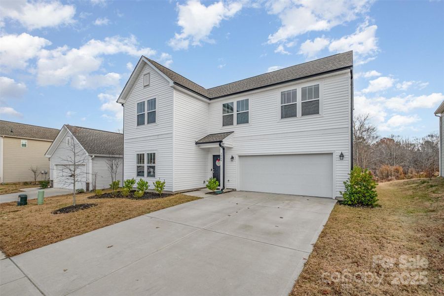 Front exterior of a new home in , Mount Holly, NC, highlighting curb appeal (Image 23).