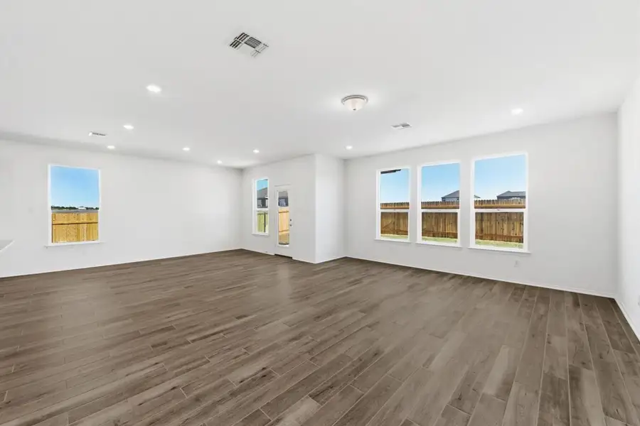Spacious, unfurnished interior of a new home in Mustang Valley, Manor (Image 5).