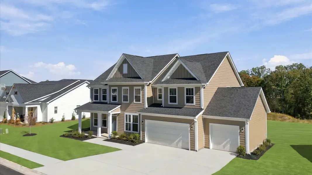 Front exterior of a new home in Pinebrook, Woodruff, SC, highlighting curb appeal (Image 22). Front exterior of a new home in Pinebrook, Woodruff, SC, highlighting curb appeal (Image 22).