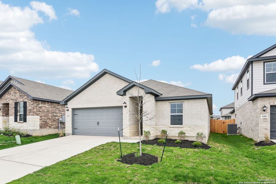 Front exterior of a new home in Sagebrooke - Premier Series, San Antonio, TX, highlighting curb appeal (Image 20).