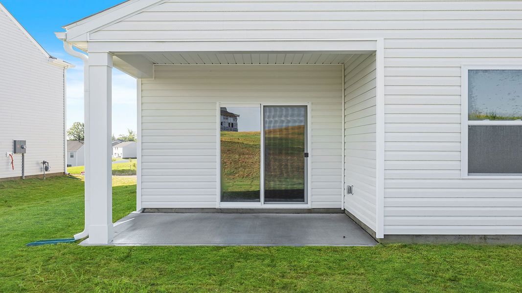 Exterior details and patio area of a home in Sherwood Gardens, Landrum (Image 3).