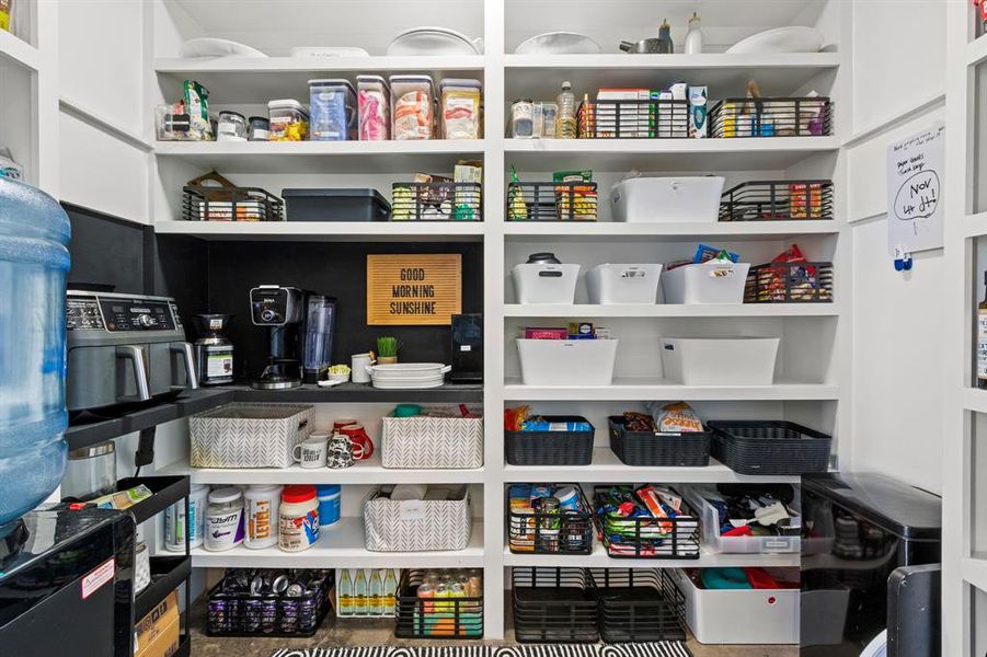 This oversized butler styled pantry has all the space needed. Electrical outlets are placed for your appliances to store in this pantry.