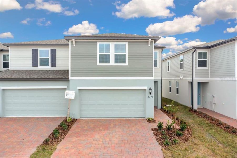 Front exterior of a new home in , St. Cloud, FL, highlighting curb appeal (Image 22).