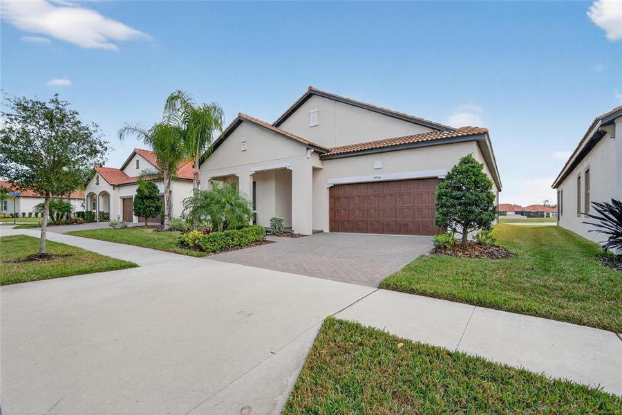 Front exterior of a new home in Southshore Bay: The Estates, Wimauma, FL, highlighting curb appeal (Image 23).