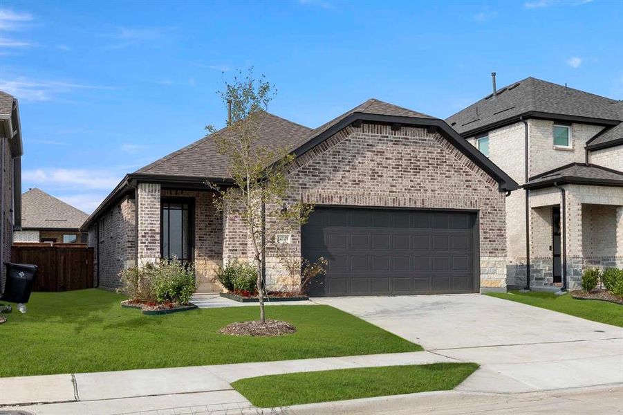 Front exterior of a new home in Creekview Fossil Ridge, Pilot Point, TX, highlighting curb appeal (Image 19). Front exterior of a new home in Creekview Fossil Ridge, Pilot Point, TX, highlighting curb appeal (Image 19).