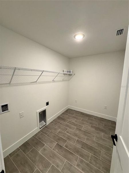 Spacious, unfurnished interior of a new home in Watercress Cove, North Port (Image 13).