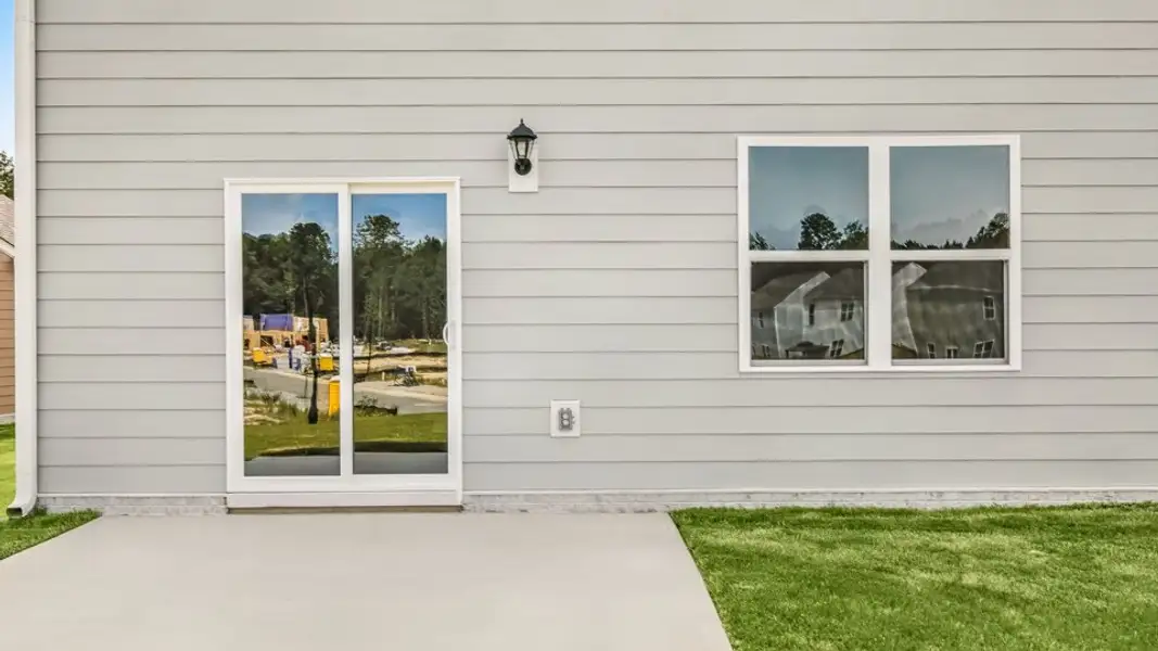 Exterior details and patio area of a home in Tyler - Home on the Lake, New Bern (Image 3).
