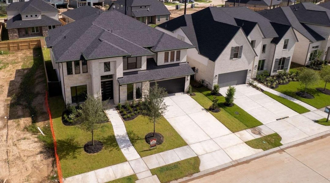 Front exterior of a new home in , Richmond, TX, highlighting curb appeal (Image 2).