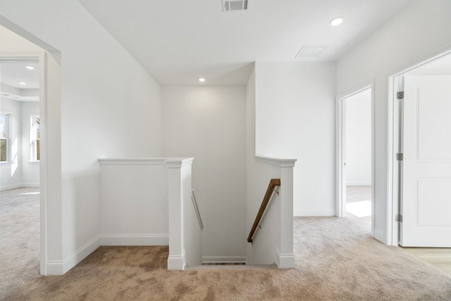 Representative unfurnished interior of a home built from the Ingram by Taylor Morrison in Falls Creek, Flowery Branch (Image 37).