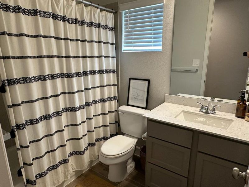 Furnished interior view inside a new home in Grand Central Park 45', Conroe (Image 14).