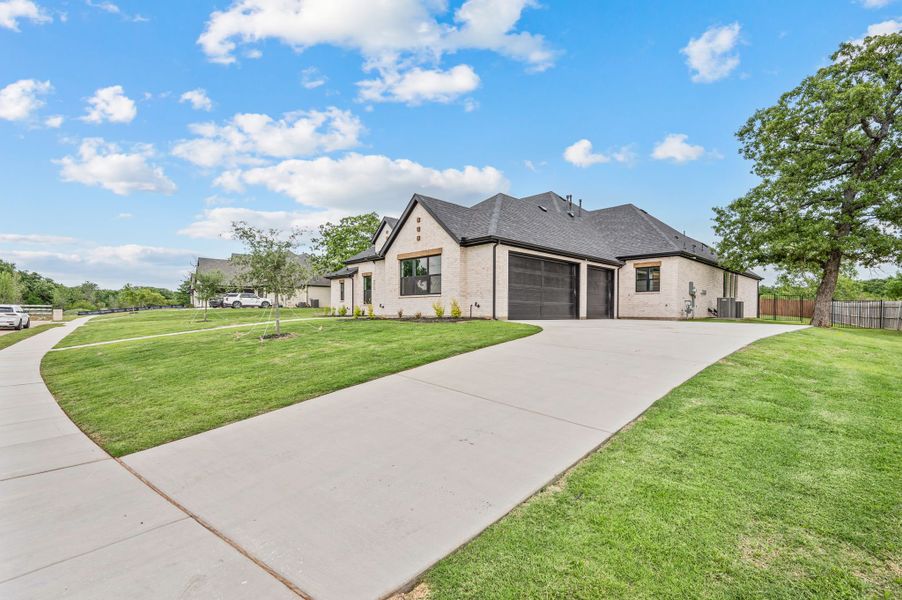 Front exterior of a new home in Highland Oaks, Boyd, TX, highlighting curb appeal (Image 27). Front exterior of a new home in Highland Oaks, Boyd, TX, highlighting curb appeal (Image 27).