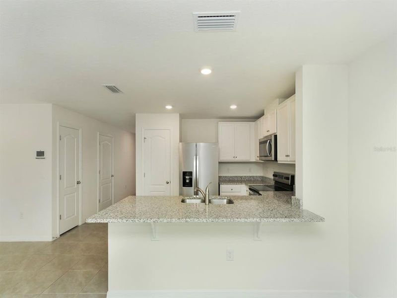 Furnished interior view inside a new home in , Harmony (Image 10).