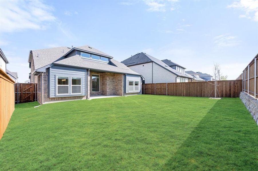 Exterior details and patio area of a home in Creekview Meadows, Pilot Point (Image 4).