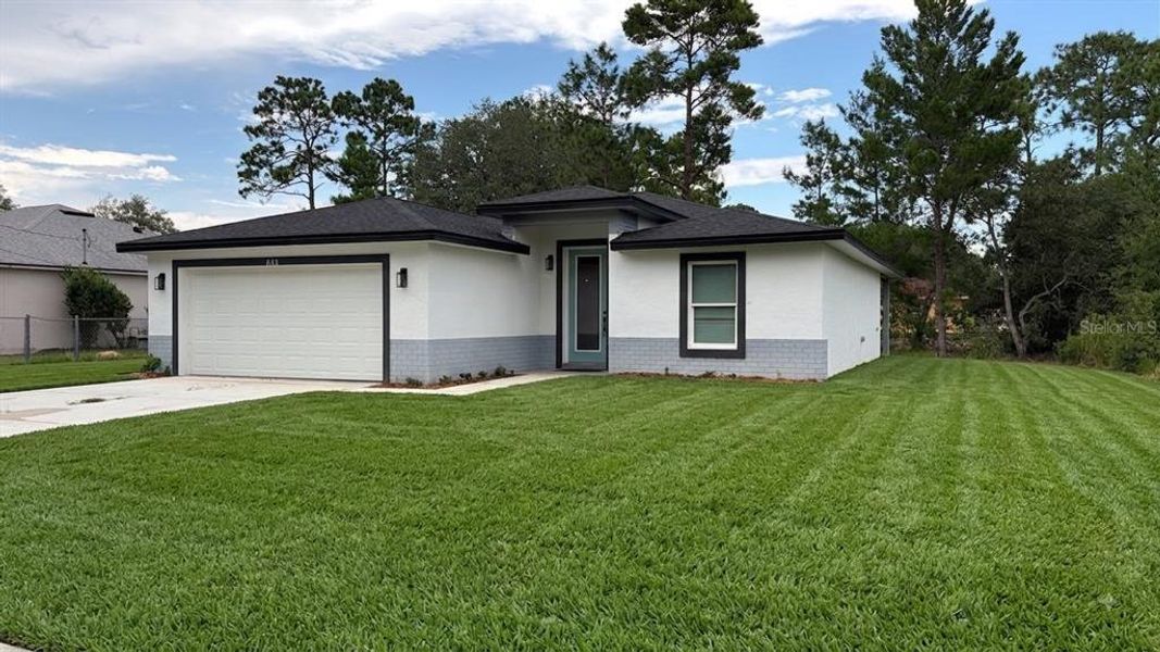 Front exterior of a new home in , Dunnellon, FL, highlighting curb appeal (Image 10). Front exterior of a new home in , Dunnellon, FL, highlighting curb appeal (Image 10).