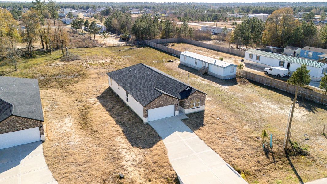 Experience breathtaking aerial views of this expansive property, perfectly showcased with drone photography. Experience breathtaking aerial views of this expansive property, perfectly showcased with drone photography.