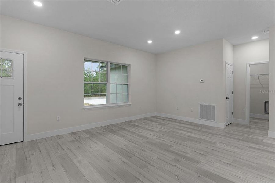 Across the living area towards the laundry room