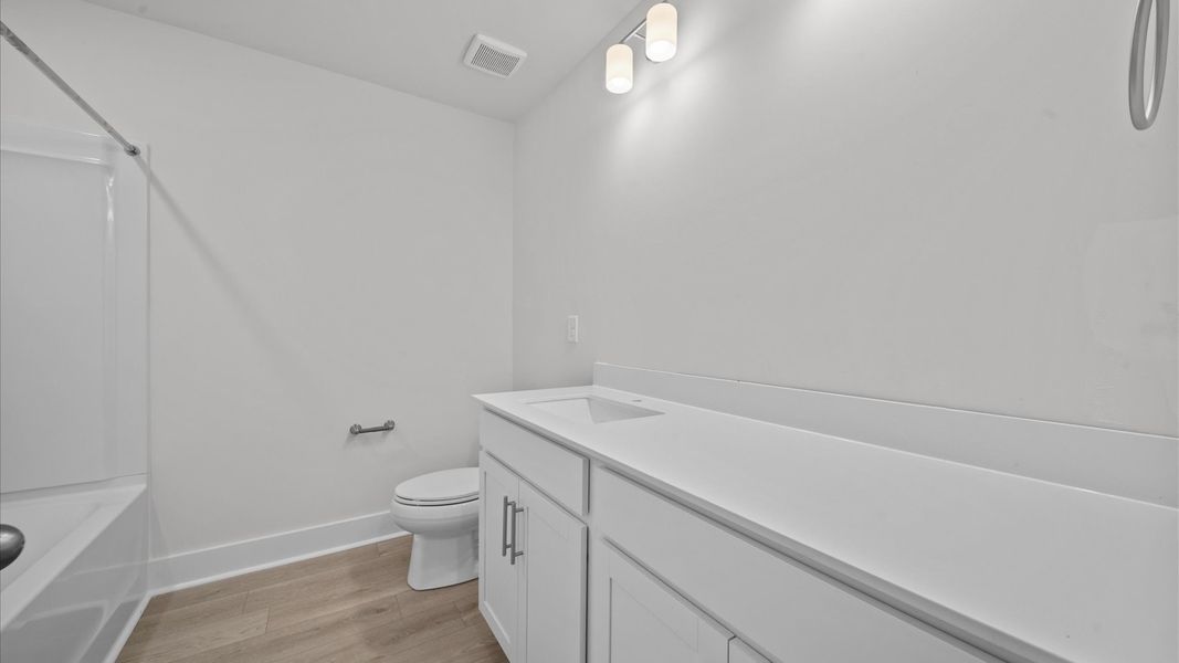 Vibrant and welcoming bathroom with elegant countertop space and polished details Vibrant and welcoming bathroom with elegant countertop space and polished details