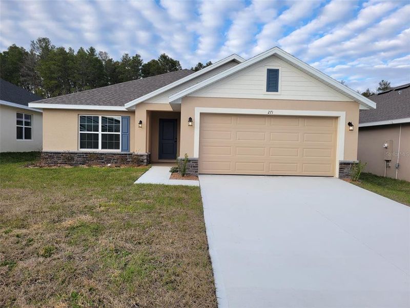 Front exterior of a new home in Arbor Park, Leesburg, FL, highlighting curb appeal (Image 1). Front exterior of a new home in Arbor Park, Leesburg, FL, highlighting curb appeal (Image 1).