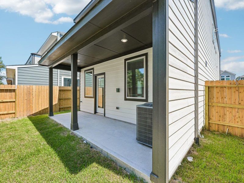 Exterior details and patio area of a home in Pinewood Trails - City Series, Atascocita (Image 3).