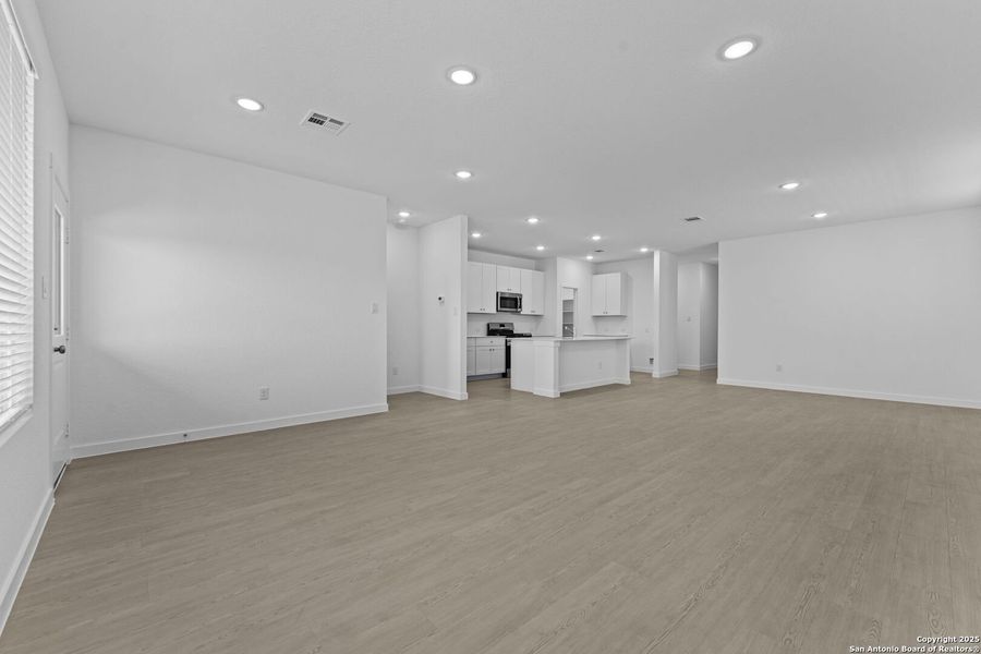 Spacious, unfurnished interior of a new home in Waterwheel: Coastline Collection, San Antonio (Image 25).