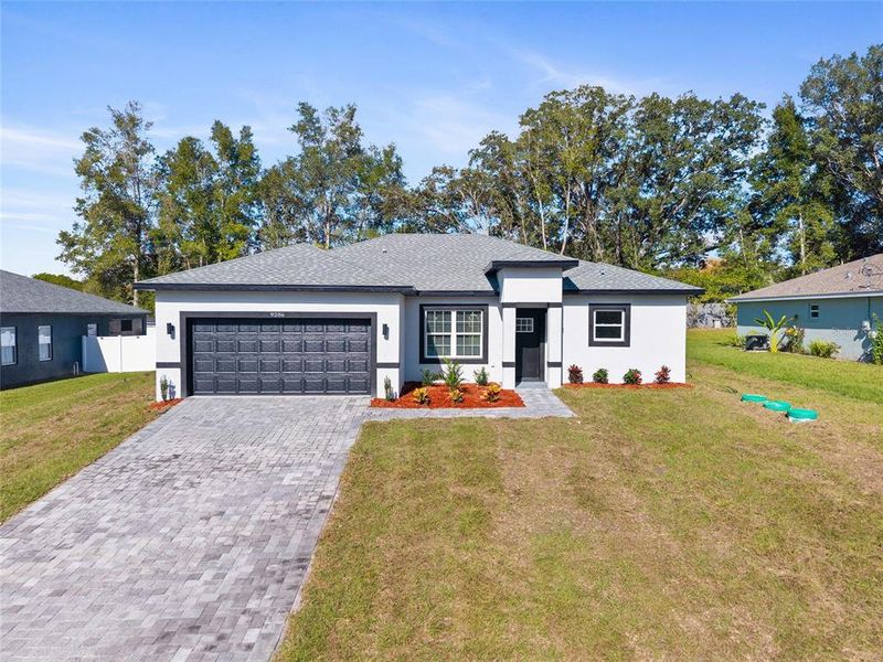 Front exterior of a new home in , Citrus Springs, FL, highlighting curb appeal (Image 1). Front exterior of a new home in , Citrus Springs, FL, highlighting curb appeal (Image 1).