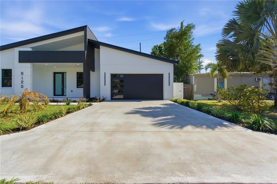 Front exterior of a new home in , Pinellas Park, FL, highlighting curb appeal (Image 26).
