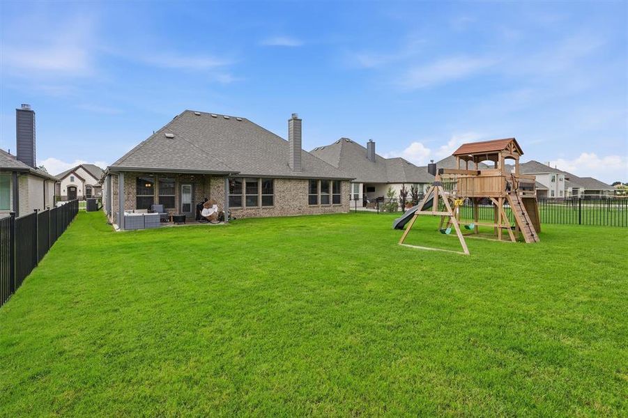 Exterior details and patio area of a home in Abe's Landing, Granbury (Image 4).