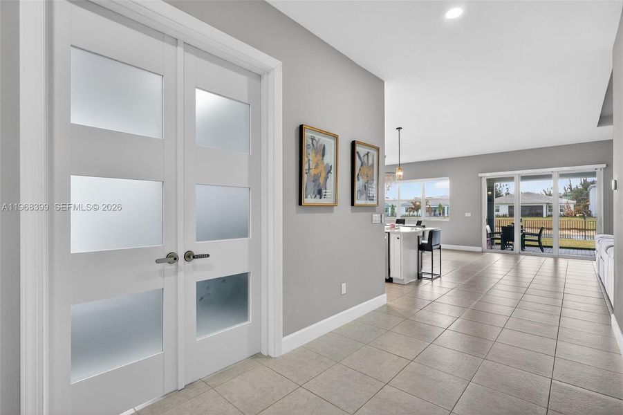 Custom private double doors with upgraded security locks enhance privacy and exclusivity for the office or man cave.