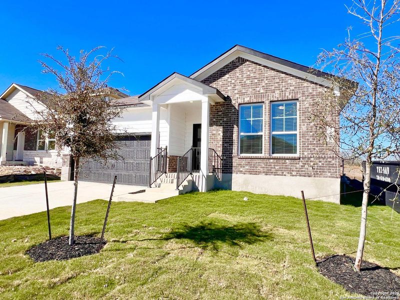 Front exterior of a new home in Horizon Pointe, Converse, TX, highlighting curb appeal (Image 19). Front exterior of a new home in Horizon Pointe, Converse, TX, highlighting curb appeal (Image 19).