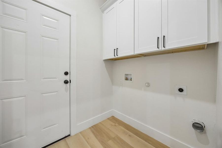 Laundry room with great storage.
