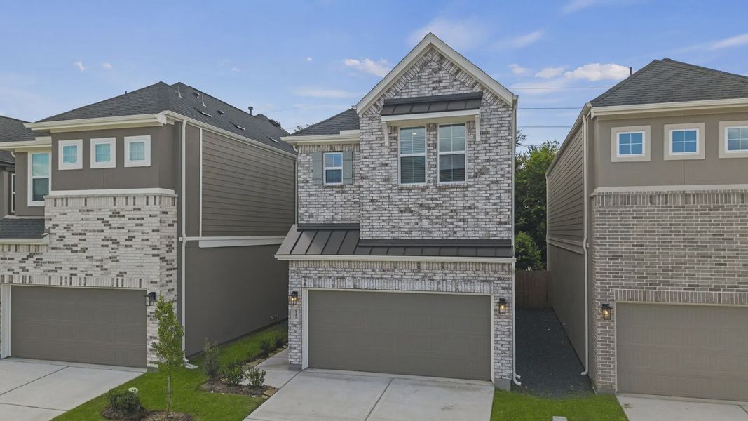 Front exterior of a new home in Santa Rita Ranch, Liberty Hill, TX, highlighting curb appeal (Image 21).