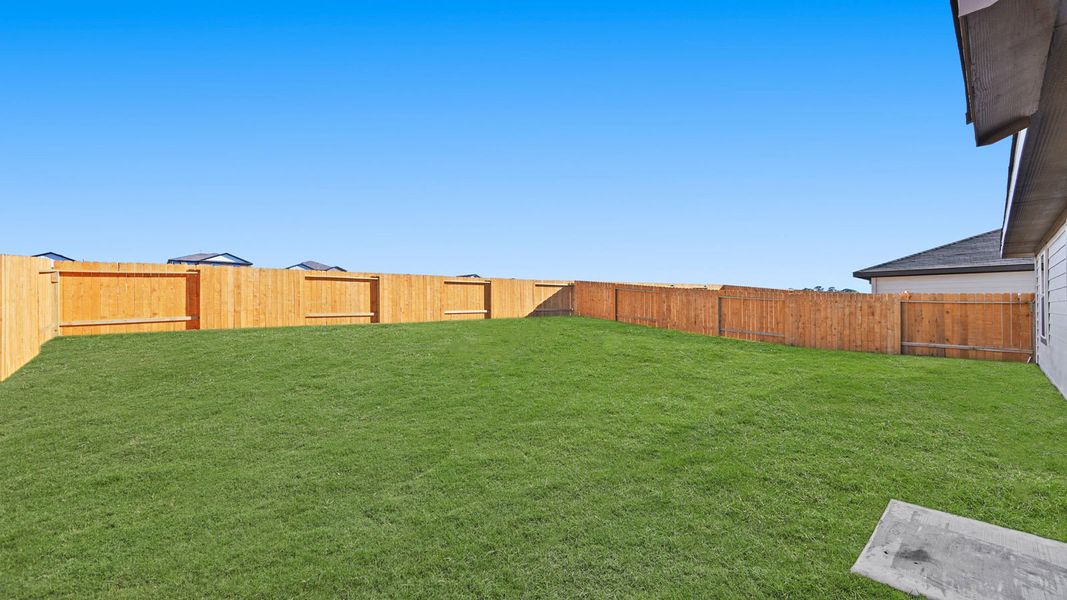 Exterior details and patio area of a home in Westward Pointe, Sealy (Image 2).