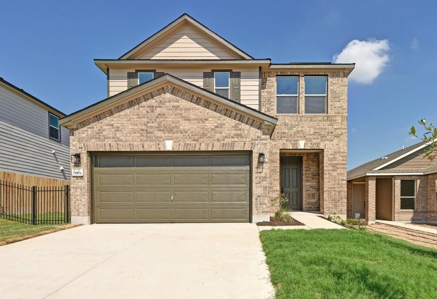 Front exterior of a new home in Creekside at Estancia, Austin, TX, highlighting curb appeal (Image 19).